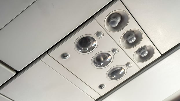 Airplane cabin vent panel reminiscent of futuristic spacecraft dashboard, perfect for Aviation Day or World Space Week inspiration photo