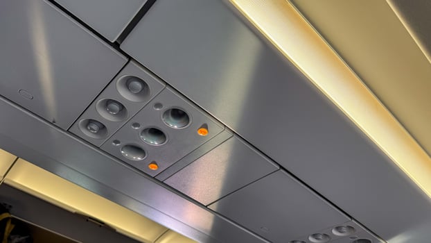Ceiling of airplane cabin with glowing lights, reminiscent of a futuristic travel odyssey or World Tourism Day celebration photo