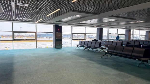 Silent airport terminal basking in morning light, echoes wanderlust, awaiting travelers for Dreamtime and Journeys Festival departures photo