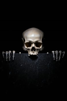 Halloween Background Human Skull with Hands on Dark Marble Surface Halloween Concept Mystery Anatomy photo