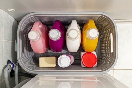 A basket filled with different colored containers photo