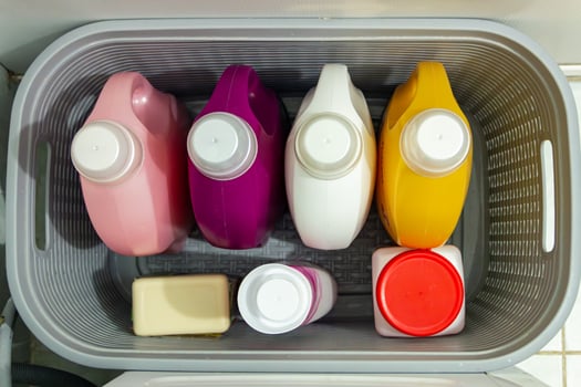 A plastic container filled with different colored containers photo