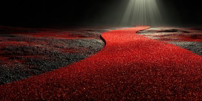 Red pathway illuminated by soft light in a dark environment creates a surreal and captivating atmosphere photo
