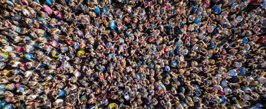 The Thriving Crowd At A Vibrant Outdoor Festival Celebrating Community And Unity photo