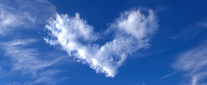 The Heart-Shaped Cloud Against the Vibrant Blue Sky photo