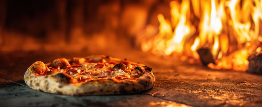 The perfect hot pizza baking in a traditional wood-fired oven. photo