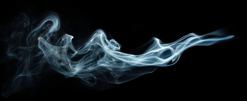 The Elegant Flow of Smoke Against a Dark Background photo