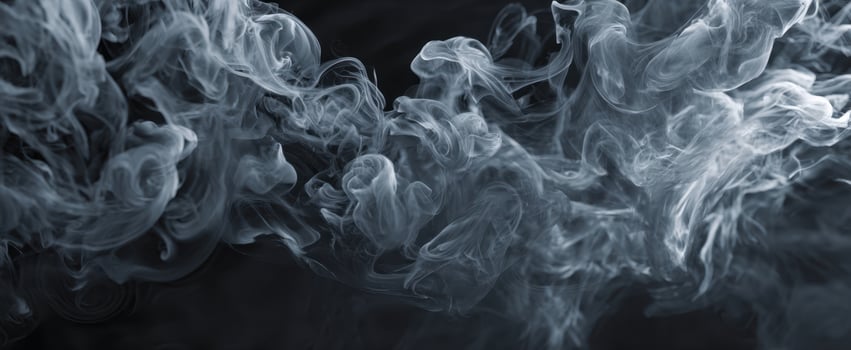 The ethereal swirls of smoke dancing in a mysterious dark background. photo