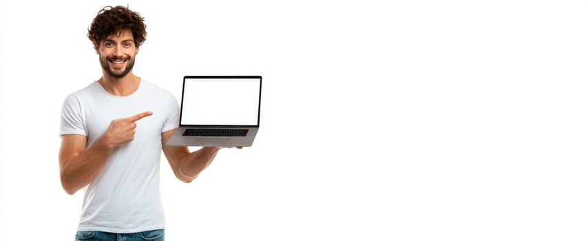 The smiling man showcasing a laptop with a blank screen against a white background. photo