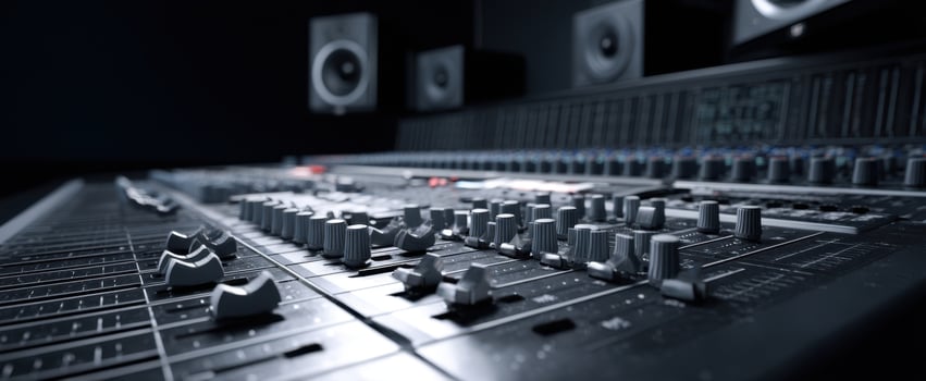 The professional audio mixing console in a modern recording studio setting. photo