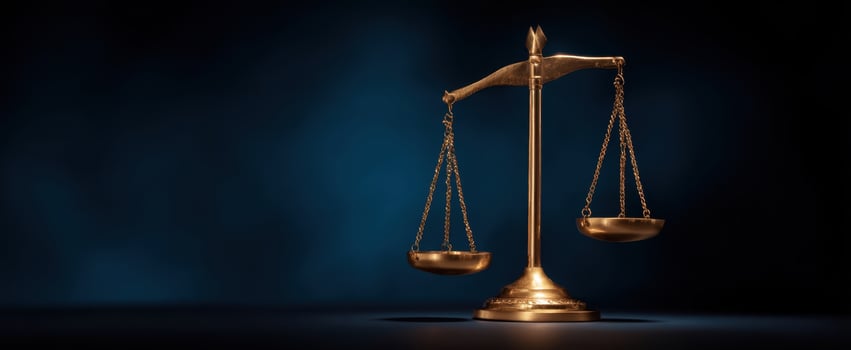 The Elegant Gold Scales of Justice on a Dark Background. photo