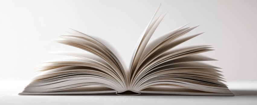 The open book showcasing its pages in an elegant presentation on a white background. photo