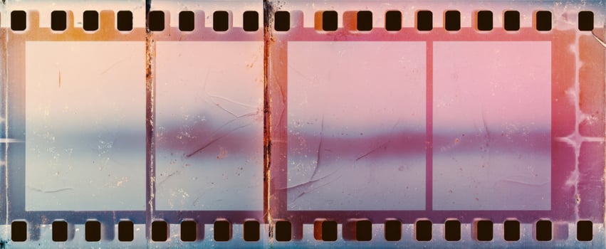 The vintage film strip with empty frames and soft pastel colors. photo