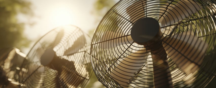 The fans spinning gently in the warm sunlight during a summer day. photo