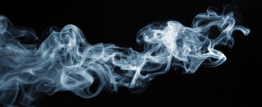The Ethereal Beauty of Wispy Smoke Against a Black Background photo
