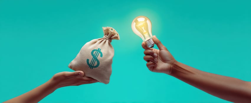 The exchange of money for innovative ideas and bright lightbulbs. photo