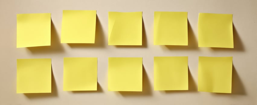 The collection of blank yellow sticky notes on a simple background. photo
