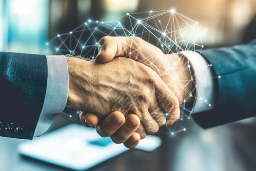 Business people shaking hands over network connection photo