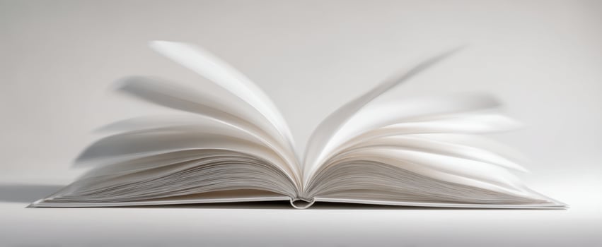 The open book with pages in motion on a minimalist background photo