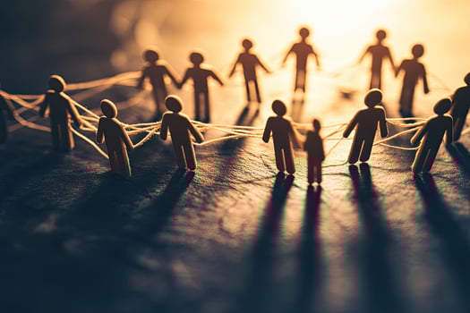 A group of people holding hands in a circle photo