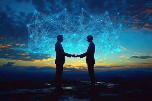 Two business people shaking hands in front of a networked sky photo