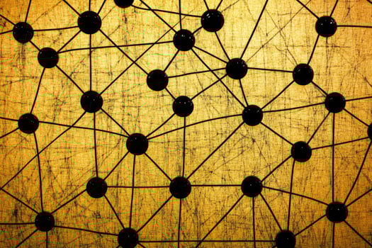 A black and gold background with many dots photo