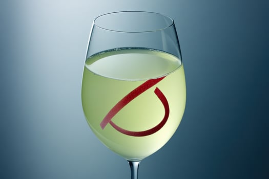 Light-colored drink with red symbol photo