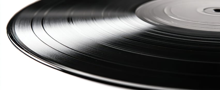 The classic vinyl record showcasing its elegant grooves and shiny surface. photo