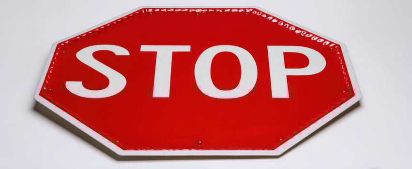 The stop sign indicating safety and traffic regulations for drivers. photo