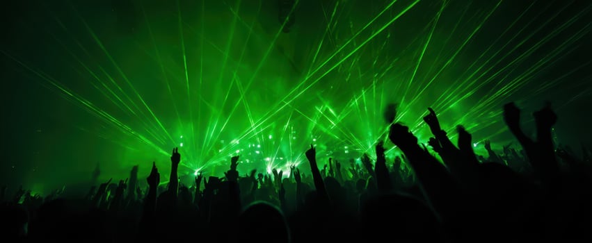The electric atmosphere of a vibrant crowd at a concert with dazzling lasers. photo