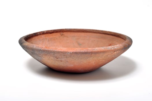 Plate-shaped containers made from clay white background photo