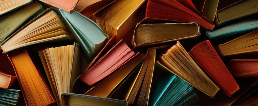 The vibrant display of assorted books arranged in a captivating jumble. photo