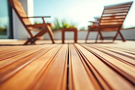 Outdoor wooden deck with lounge chairs photo
