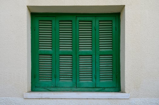 Green Window with Wooden Shutters in Traditional Cyprus House photo