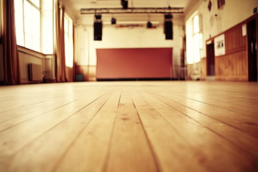 Empty hall with wooden floor and stage photo