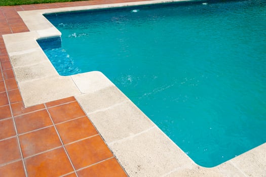 luxury villa poolside with custom stone and tile work, summer background concept photo