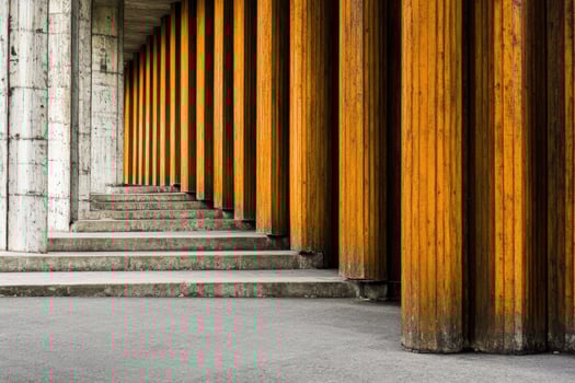 Perspective of orange columns and concrete steps photo