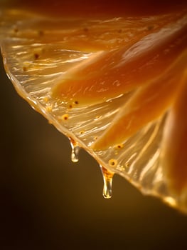 Close up of Amber Liquid Dripping, Abstract Background Image. photo