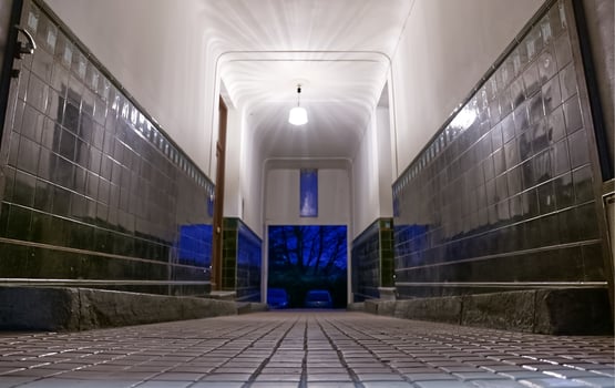 Serene Hallway with Glossy Tiles and Blue Light photo