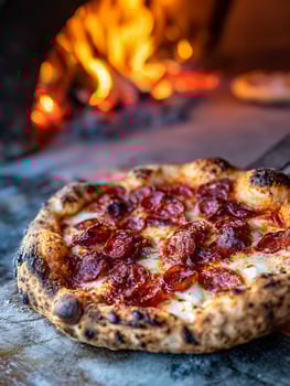 Close up of a delicious pepperoni pizza fresh from a wood fired oven. photo