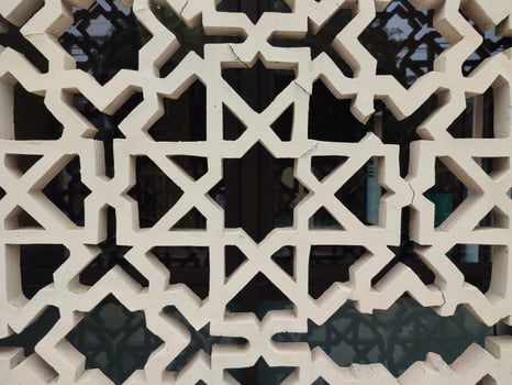 A detailed Islamic geometric mosaic featuring bright colors and symmetrical patterns photo