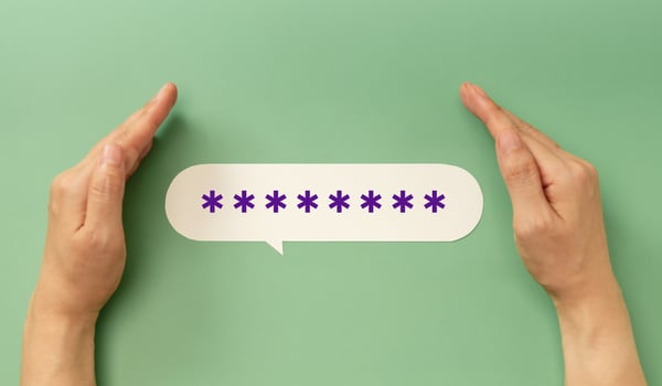 Hands protecting a hidden password speech bubble symbolizing online security and privacy in digital communication photo