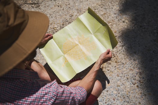 Traveler Examining a Map of a Historic Spanish City While on Vacation photo