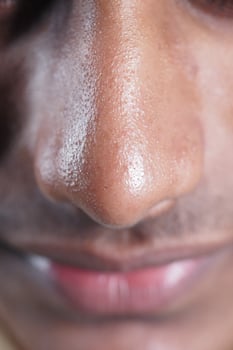 Close-up view of a man's nose and lips during daytime photo