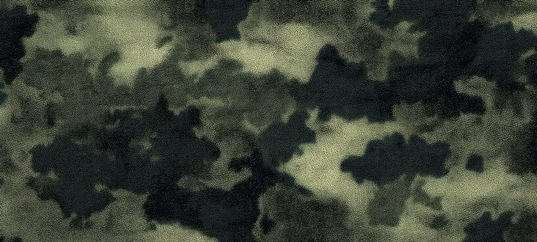 The textured camouflage pattern featuring shades of green and black. photo