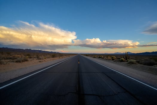 Nature Background Dramatic Desert Highway Sunset Landscape Open Road Clouds and Cactus photo