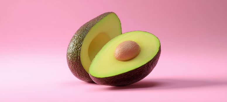 The fresh avocado sliced in half revealing its vibrant green flesh and seed. photo