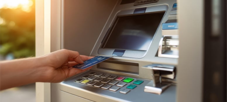 The ATM machine displaying cash withdrawal options for users. photo