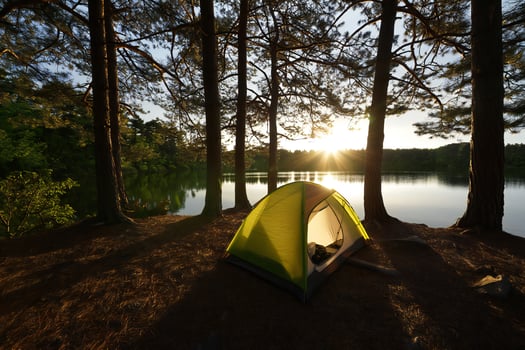 Nature Background Serene Sunset Camping Scene Lakeside Tent in Pine Forest photo