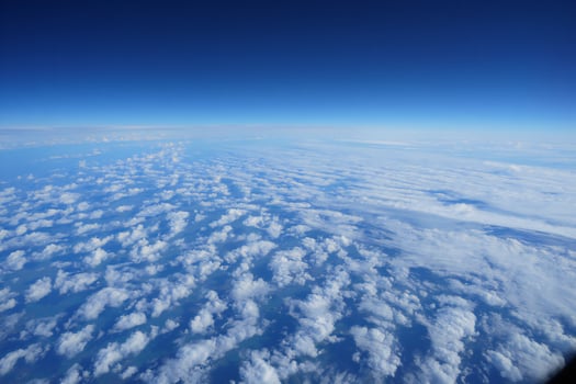 Nature Background Aerial View of Cumulus Cloudscape Vast Blue Sky High Altitude Flight photo